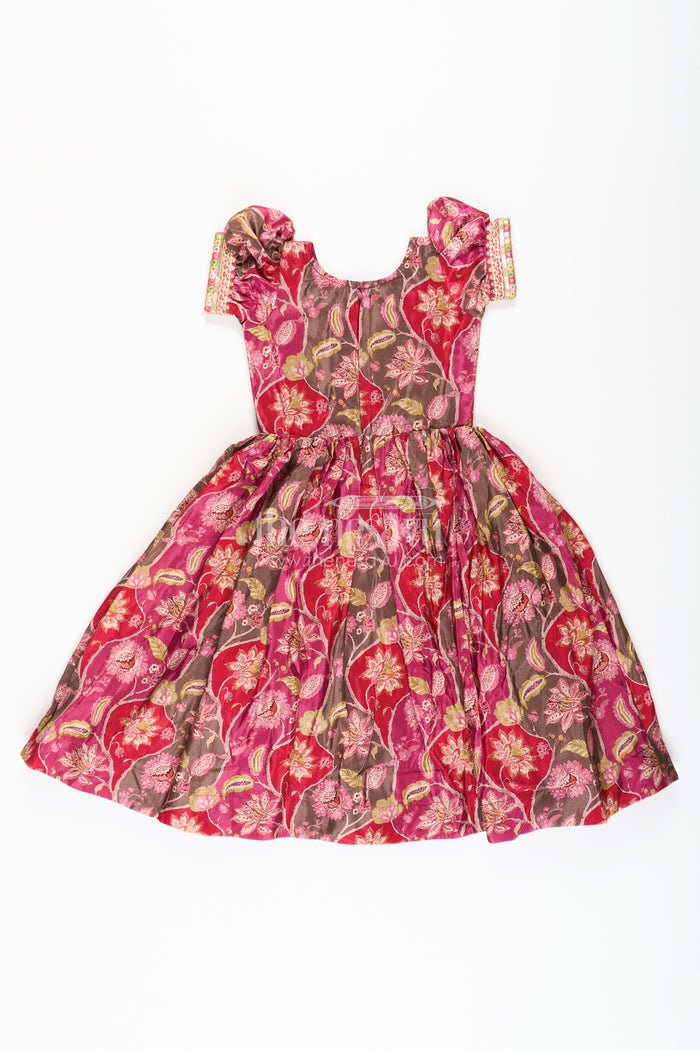 The Nesavu Girls Silk Gown Girls Bride in Wedding Dress Style Chinon Silk Gown with Intricate Mirror Work and Rich Floral Pattern Nesavu Girls Bride Wedding Dress Inspired Chinon Silk Gown Mirror Embellishment Floral Print | The Nesavu