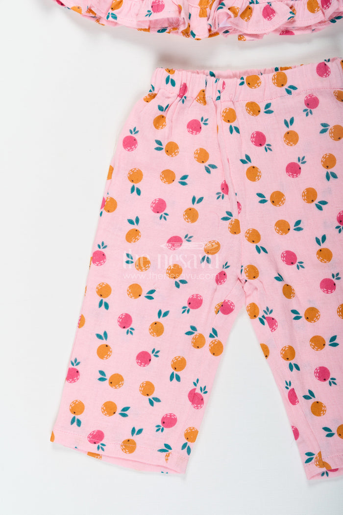 The Nesavu Girls Casual Set Girls Muslin Pink Ethnic Wear Set with Ruffle Top and Printed Pants for Comfortable Everyday Style Nesavu Nesavu Girls Muslin Printed Pink Ethnic Wear Set with Ruffle Top and Matching Pants for Daily Comfort