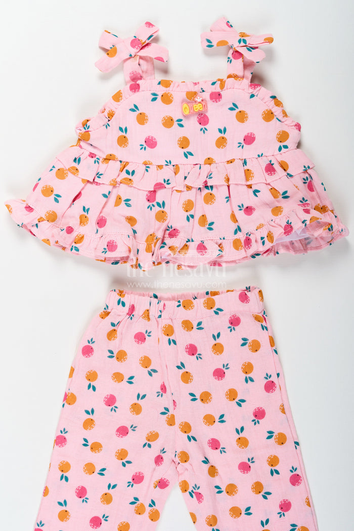 The Nesavu Girls Casual Set Girls Muslin Pink Ethnic Wear Set with Ruffle Top and Printed Pants for Comfortable Everyday Style Nesavu Nesavu Girls Muslin Printed Pink Ethnic Wear Set with Ruffle Top and Matching Pants for Daily Comfort