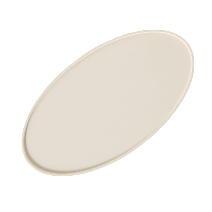 A plain, oval-shaped, off-white ceramic plate is displayed on a white background, evoking the smooth elegance of the Lani Oval Coffee Table White Wash (120 x 39 x 65cm).